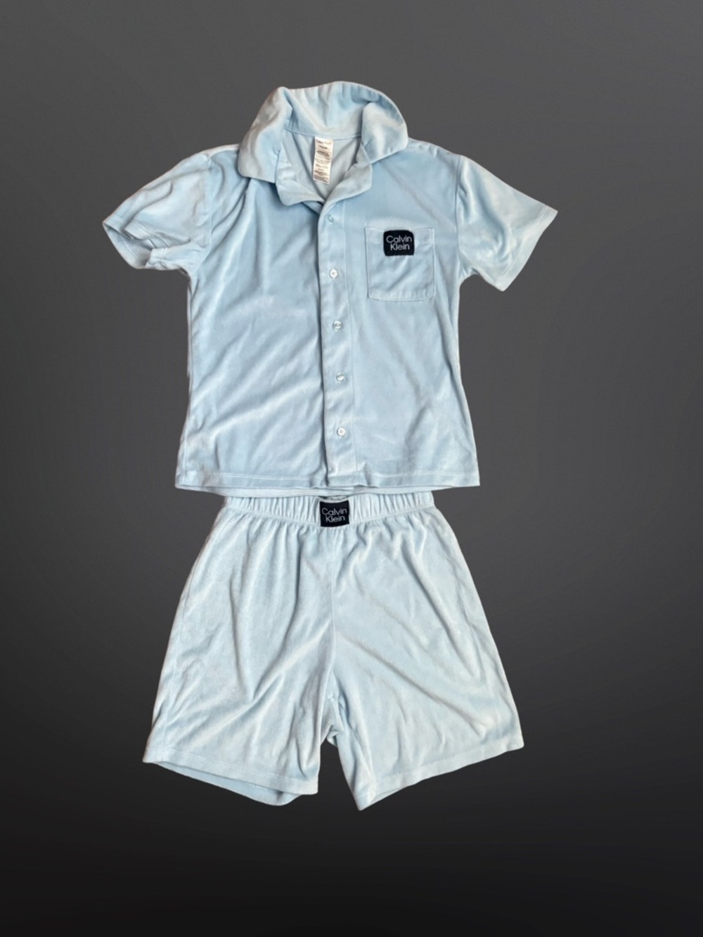 Calvin Klein two-piece pajama set made from a soft velour or terry-like fabric